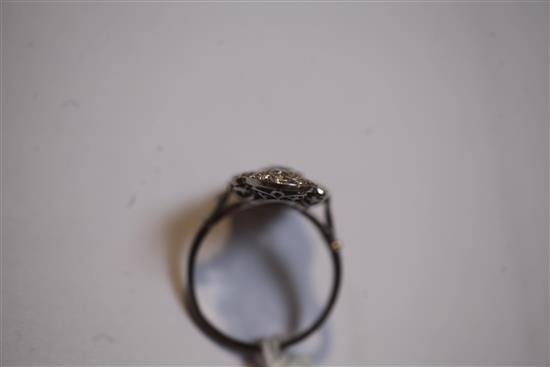 An attractive early 20th century French platinum and diamond cluster upfinger dress ring, size Q.